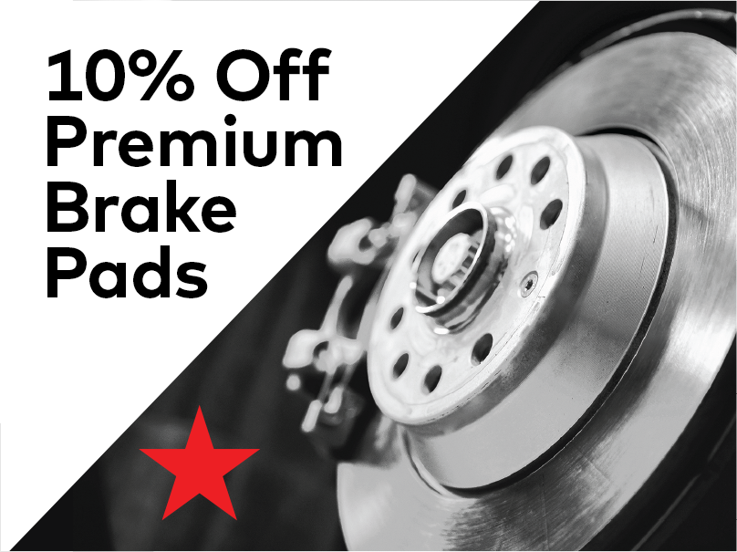 Image showing a close-up of a car brake disc and caliper on the right. Text on the left reads 10% Off Premium Brake Pads in bold letters, with a red star below the text, all set against a white and black background. EuroMechanic - McNally Auto | Top Reviewed Auto Repair Shop in North York | Visit EuroMechanic - McNally Auto