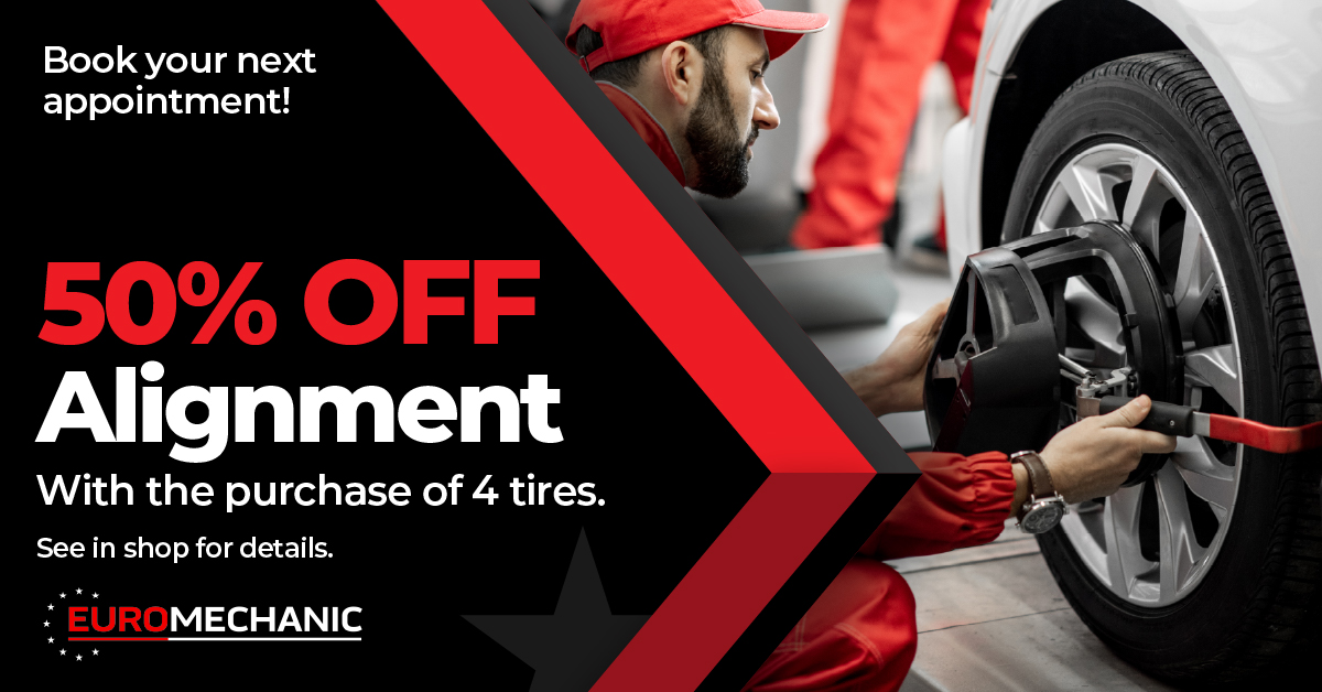 A mechanic in a red uniform works on a car tire. Text on image advertises “50% OFF Alignment with the purchase of 4 tires” at EuroMechanic, and encourages booking an appointment. EuroMechanic - McNally Auto | Top Reviewed Auto Repair Shop in North York | Visit EuroMechanic - McNally Auto